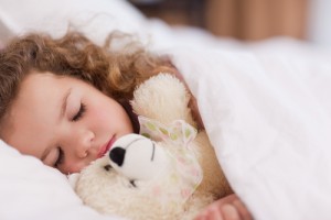 sleeping child with animal