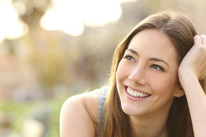 Woman with Porcelain Veneers Takes good Care of Them